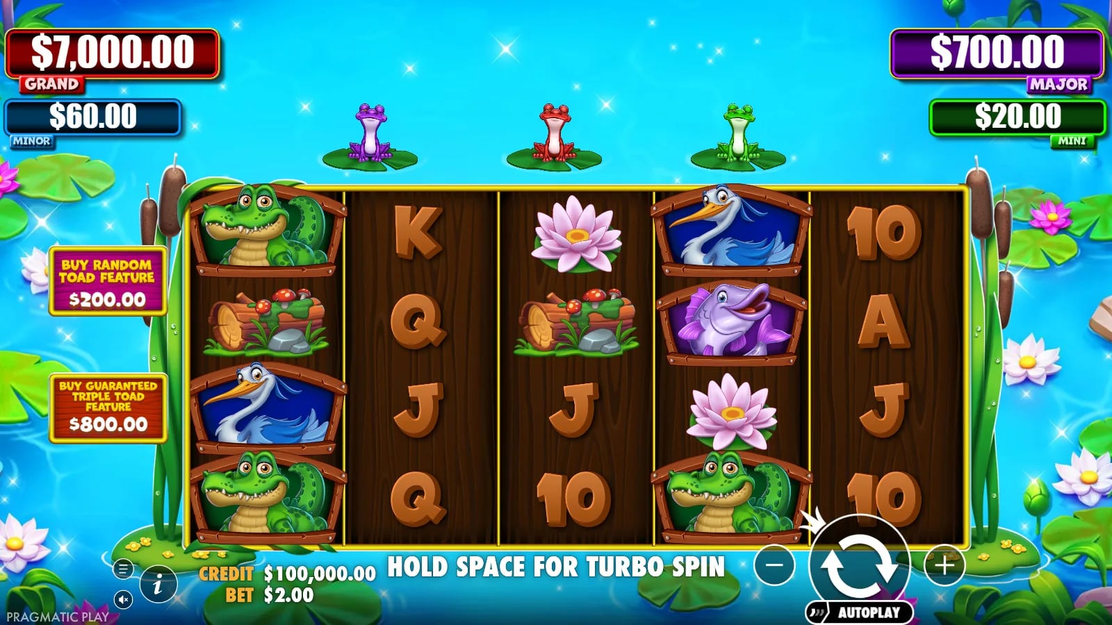Tiny Toads ordinary 5×4 board with three coloured toads, virtual $2 bet and two Free Spins buy controls.