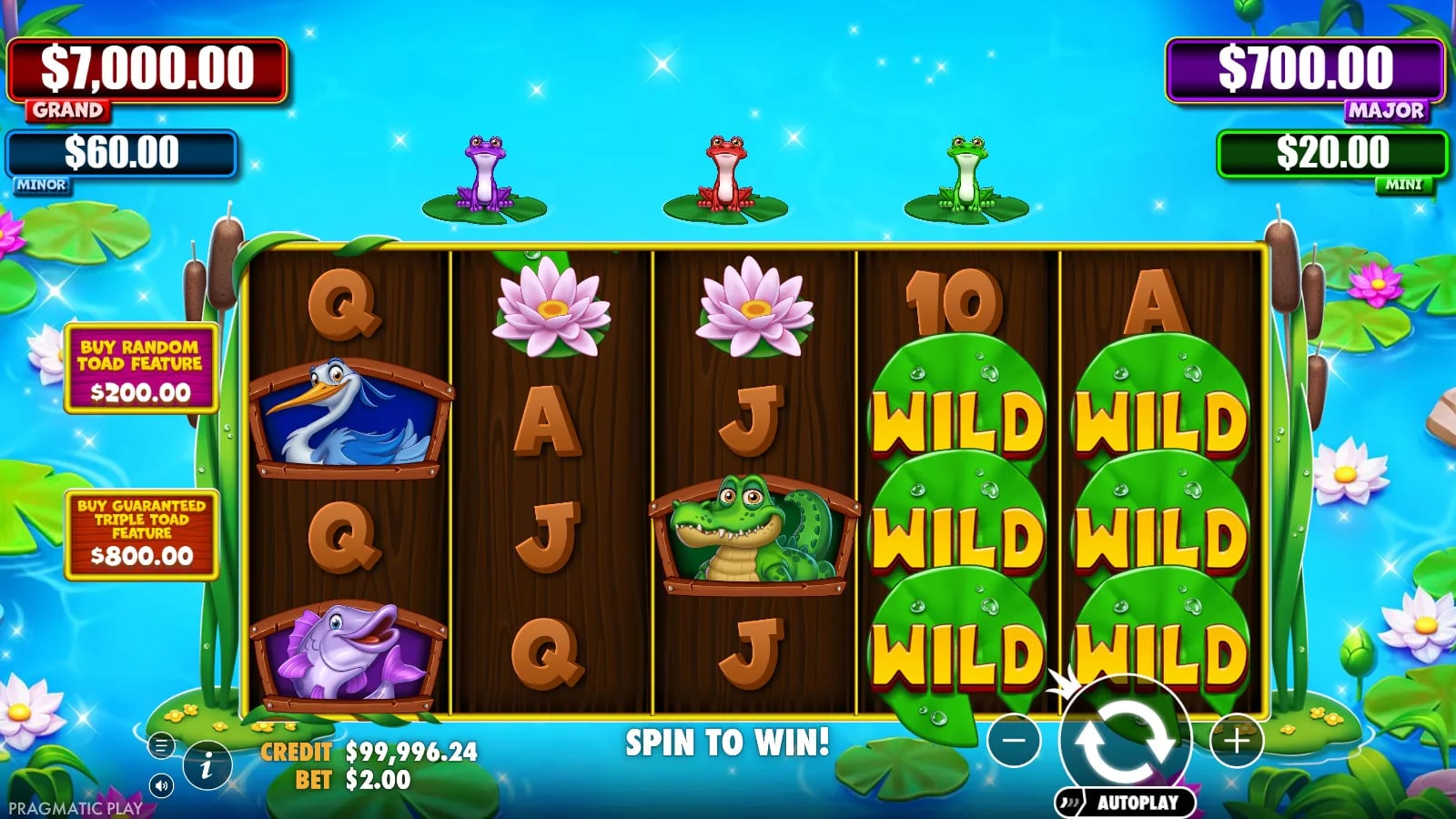 Tiny Toads base board showing two full green Wild reels at a $2 virtual bet, without a displayed bonus state.