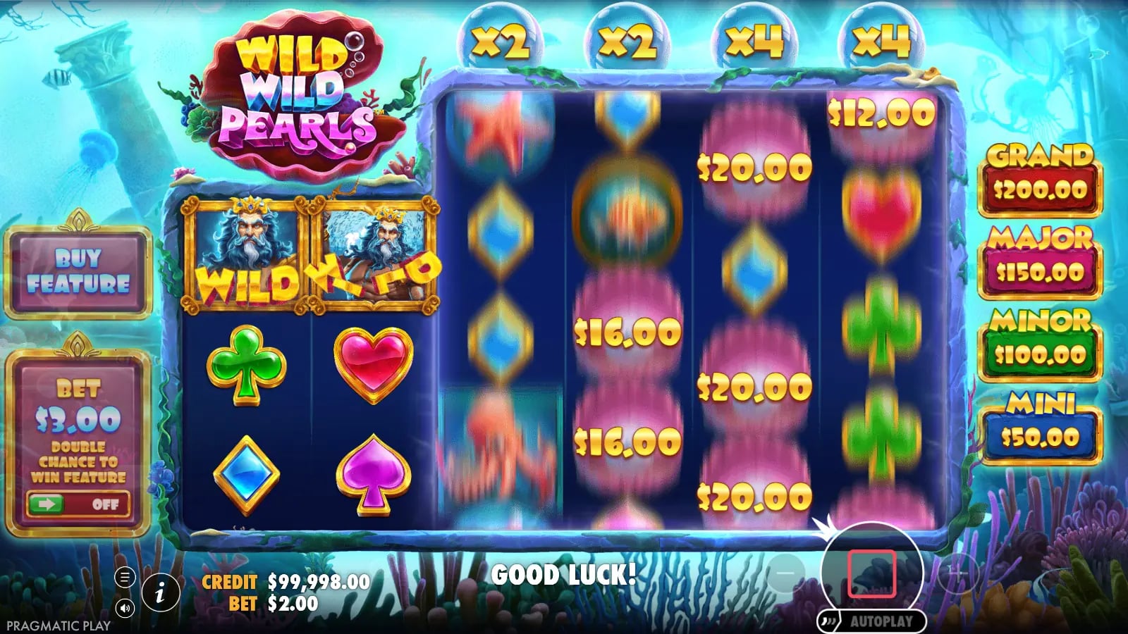 Wild Wild Pearls base-game reels spinning with first-two-reel Wilds, pearl values and x2/x4 reel multipliers.
