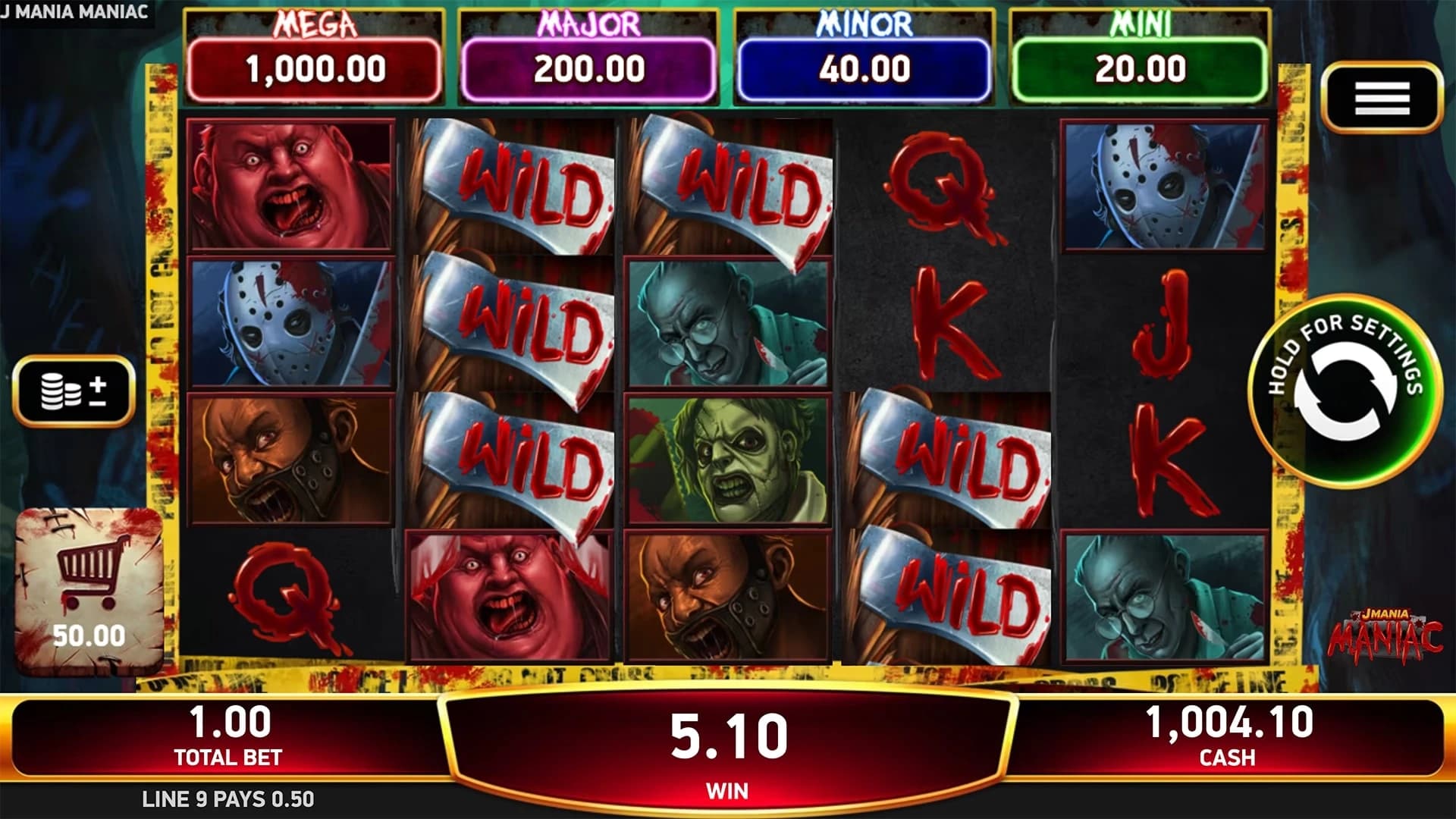 J Mania Maniac: Main horror reel field with the four jackpot labels and Wild symbols.